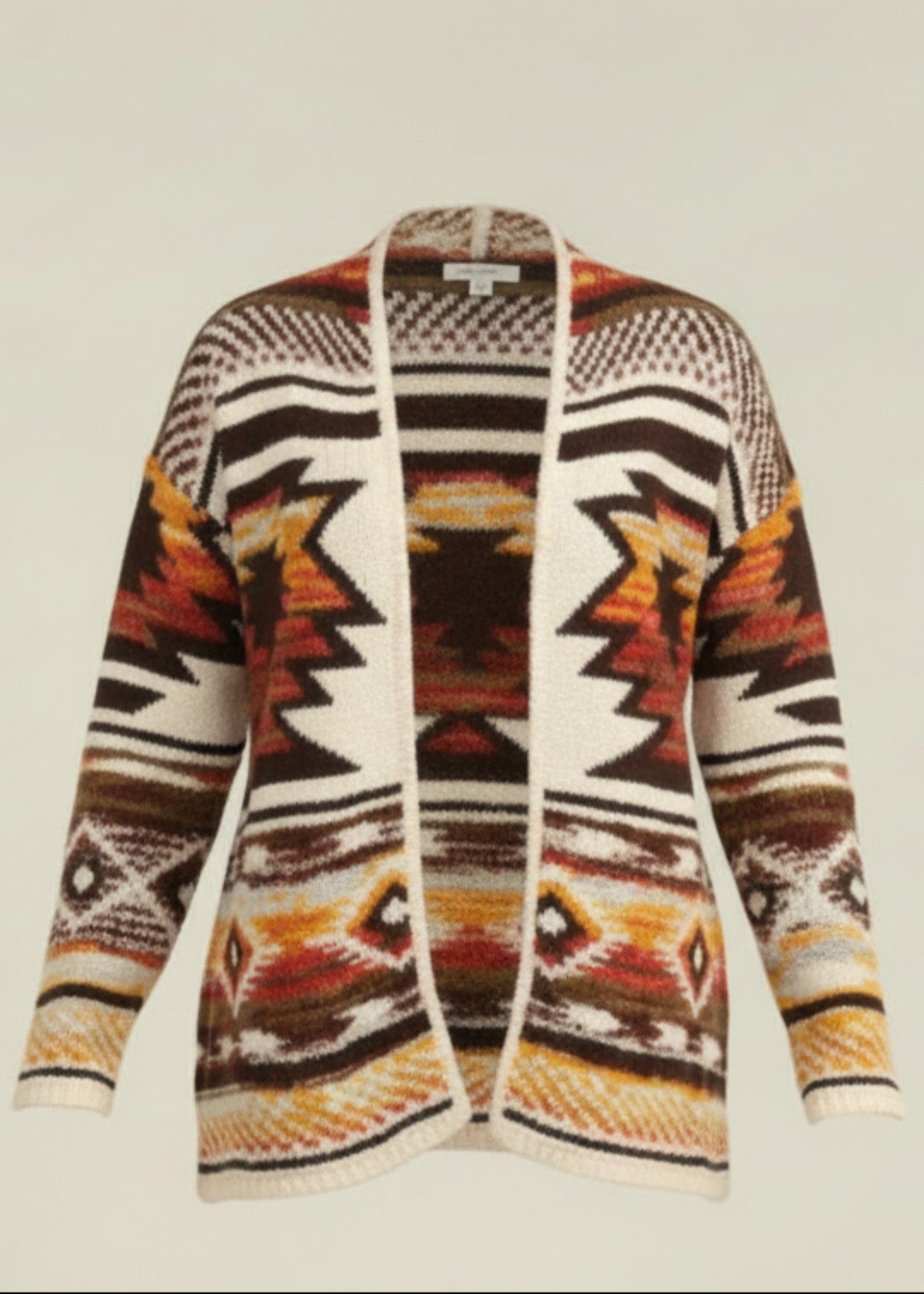 Woman wearing a patterned cardigan with a neutral background