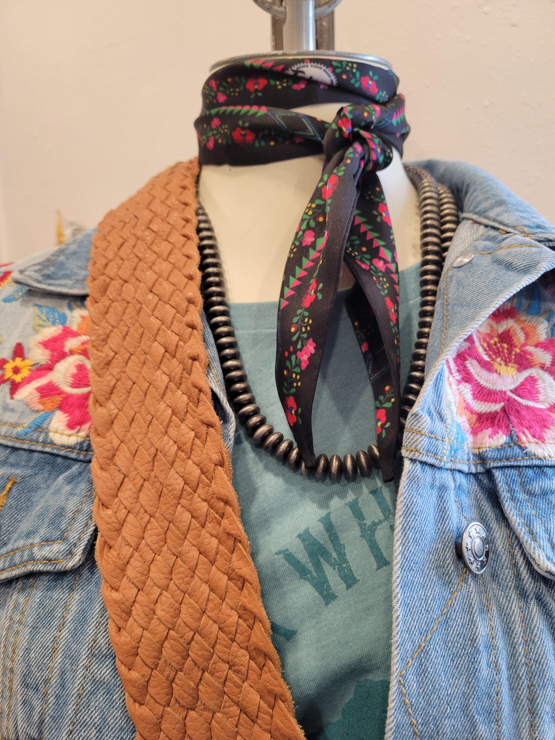 Fringe Twilly is tied around the neck as a fun addition to any outfit.