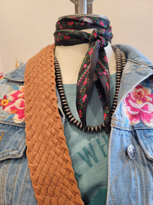Fringe Twilly is tied around the neck as a fun addition to any outfit.